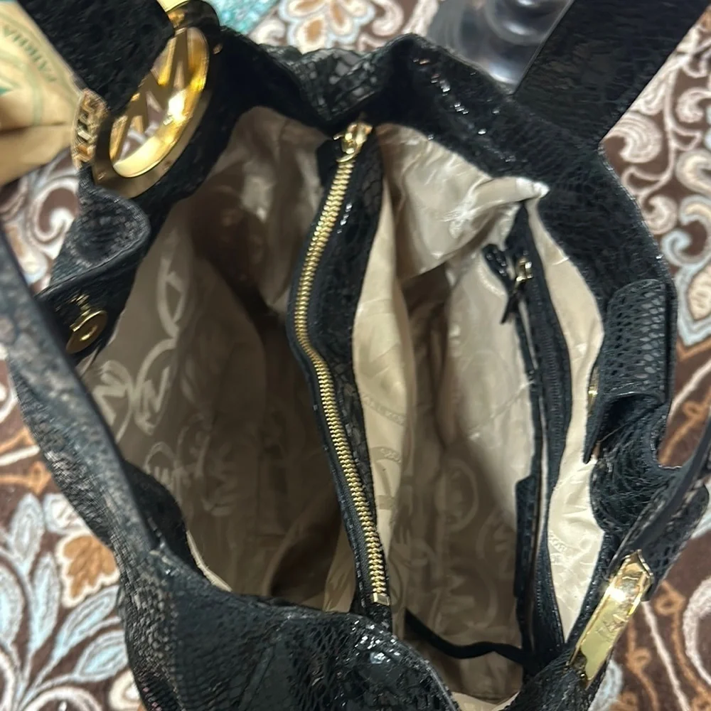 Michael Kors Black Hobo Bag with Gold Emblem